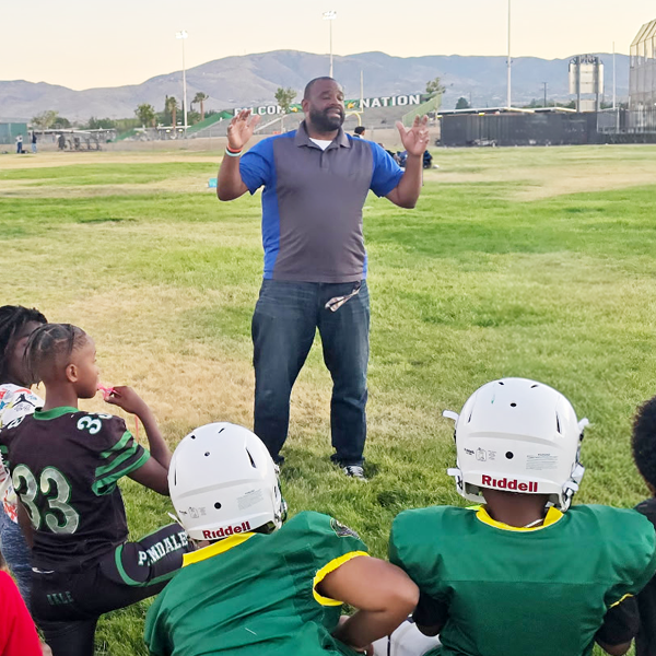 Getro speaking to little league football children